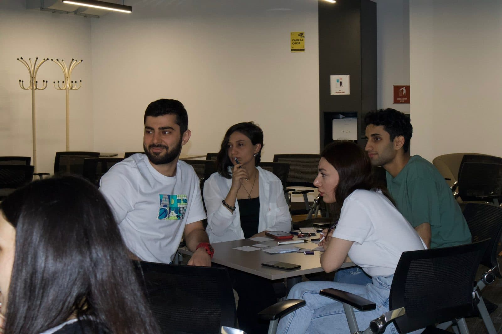 Members working together around a meeting table