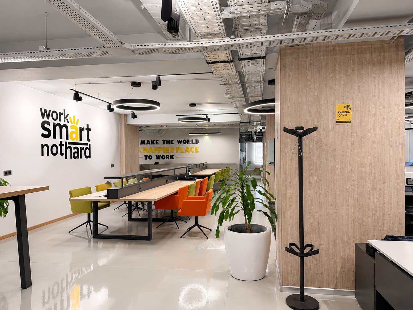 Open-plan coworking floor with shared desks at Lotfi Zadeh, Baku